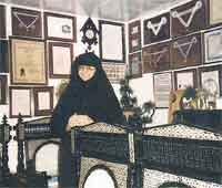 Evgenia Kleidara, Mother Superior of Agios Raphael pictured above with the many awards bestowed upon her and the sacred place she oversees. In 1996 The American Biographical Institute awarded her the converted title of 'Woman of the year' 